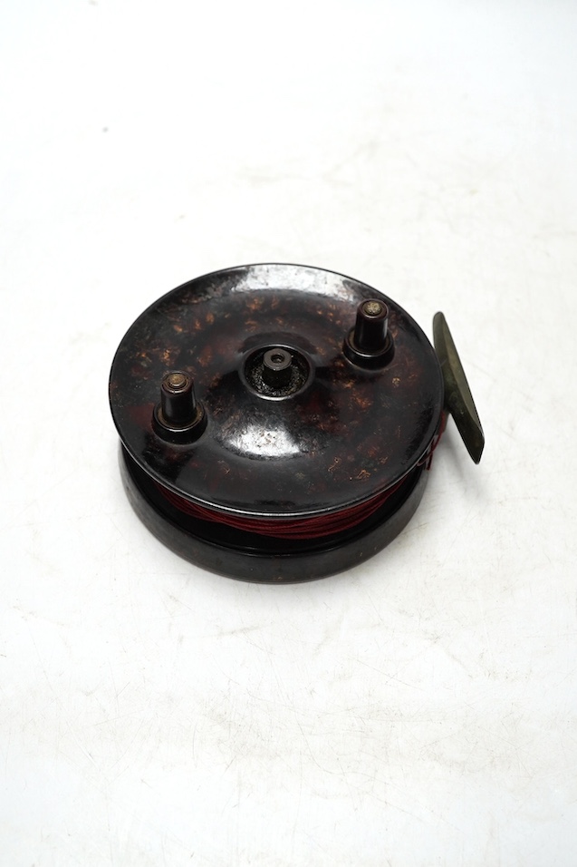 Four fishing reels, including a Bakelite Alcock Aerialite, an Elo, a Seprage C.A.P and a wooden reel, largest 10.5cm diameter. Condition - used, fair
